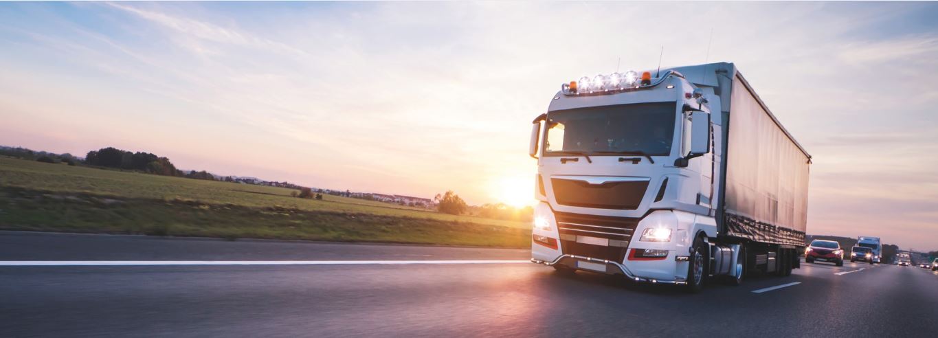 A truck from the freight forwarding industry transports goods on the motorway.