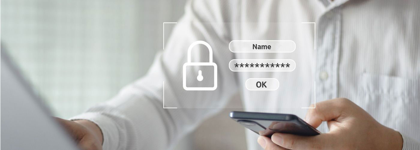 Log-in area of the Deutsche Factoring Bank Person in a white shirt sitting in front of a laptop and holding a black smartphone. A lock symbol with user name and password is placed over the picture. This is to show the login area.